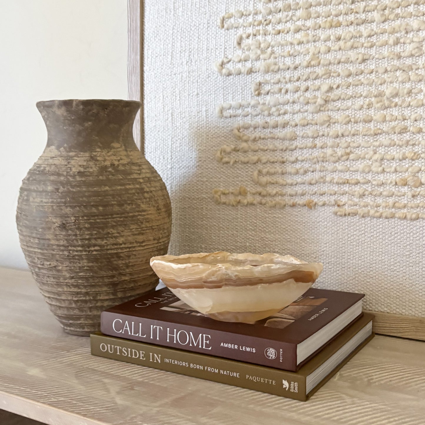 Hand carved small amber onyx stone bowl with natural translucent veining