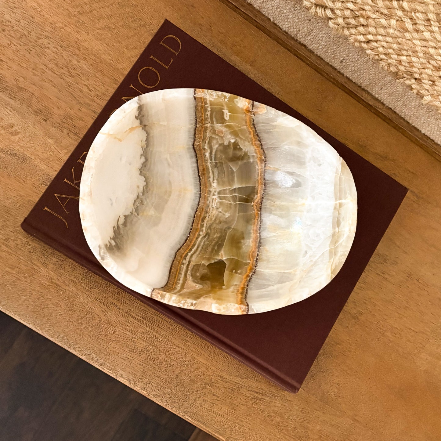 Olive onyx bowl with natural stone striations and polished texture