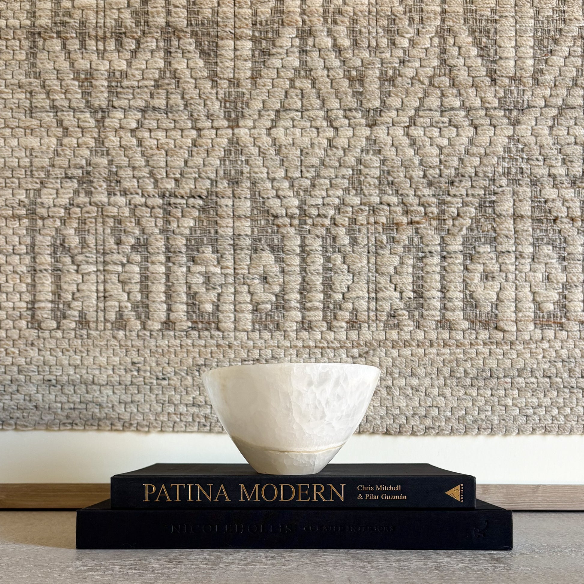 Luxury white onyx decorative bowl styled on a coffee table in a refined modern interior