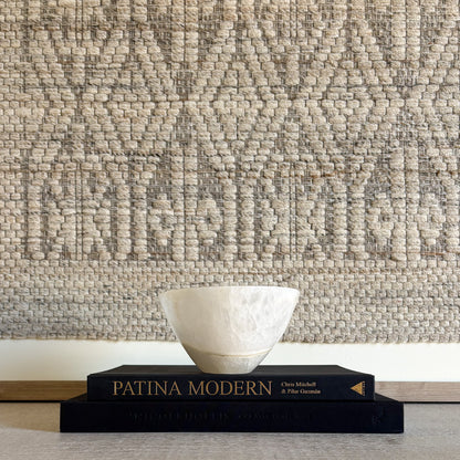 Luxury white onyx decorative bowl styled on a coffee table in a refined modern interior