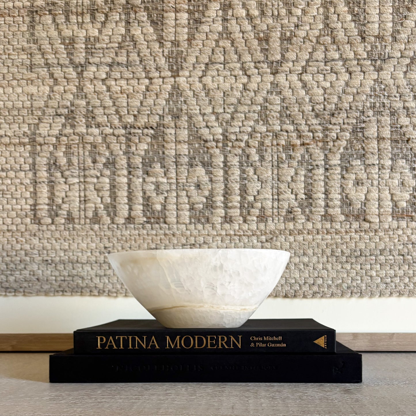 Small white onyx bowl shown in hand to highlight scale and handcrafted stone design