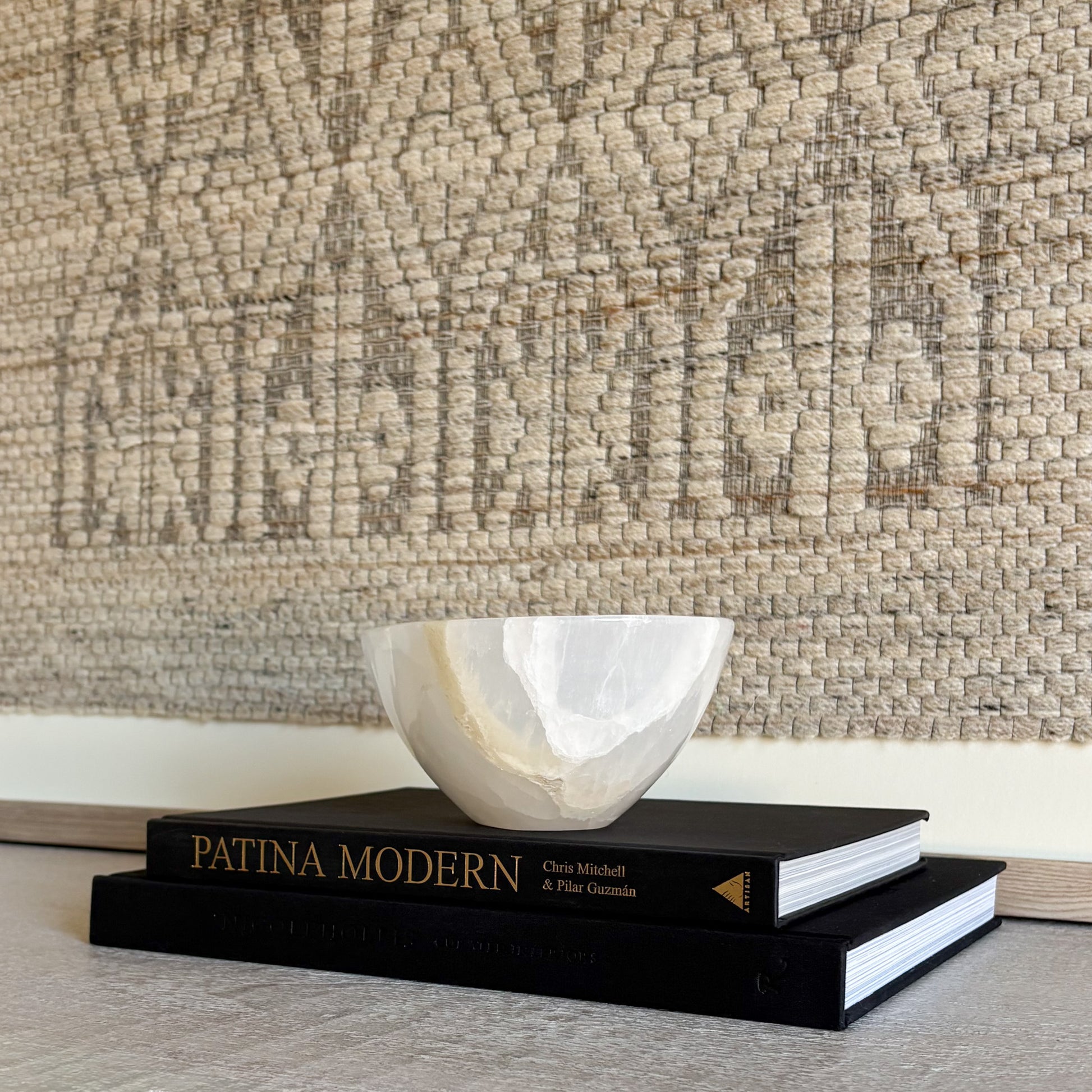 Luxury white onyx decorative bowl styled on a coffee table in a refined modern interior