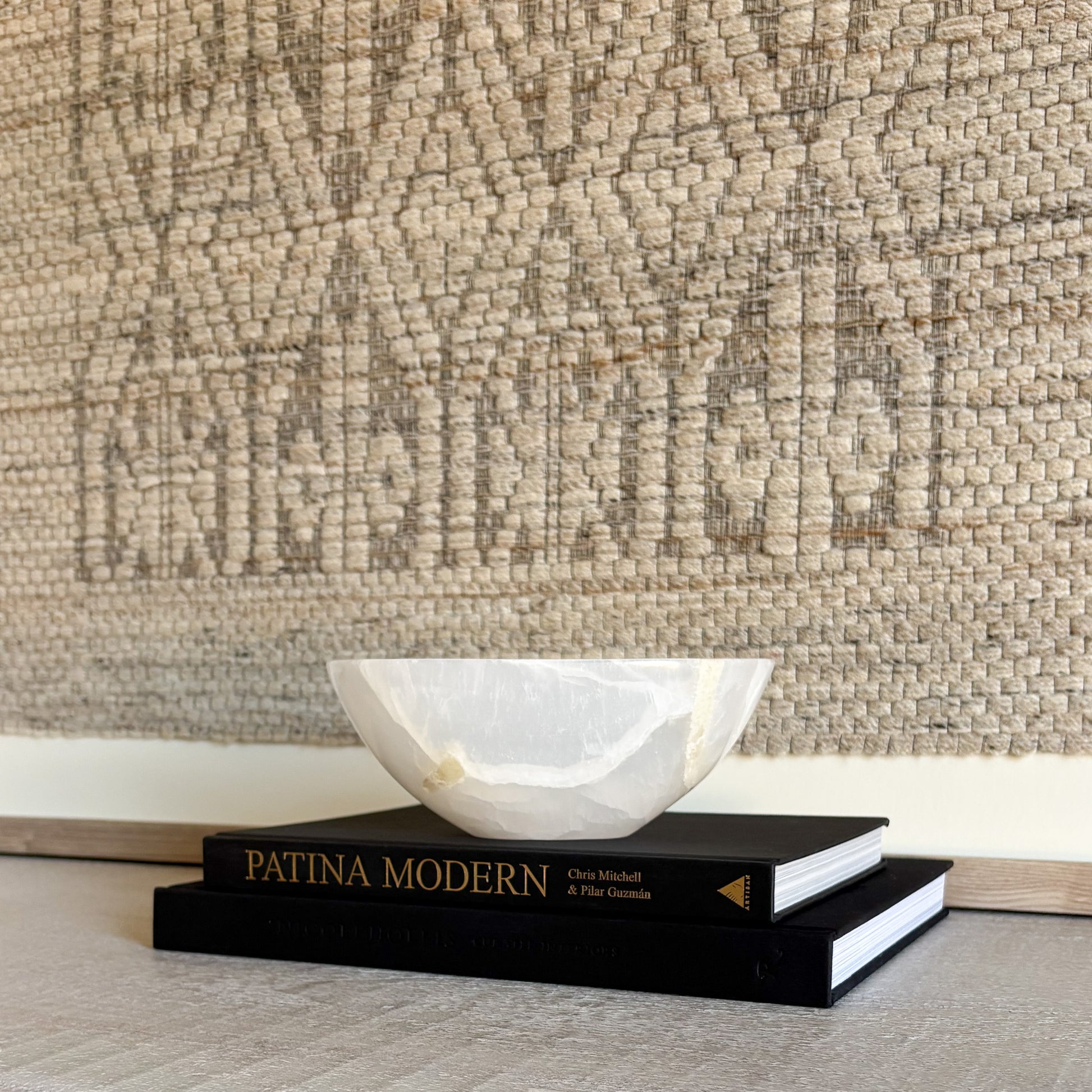 Small hand-carved white onyx bowl in natural stone, luxury decorative accent with soft veining