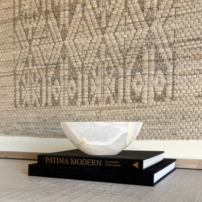 Small hand-carved white onyx bowl in natural stone, luxury decorative accent with soft veining