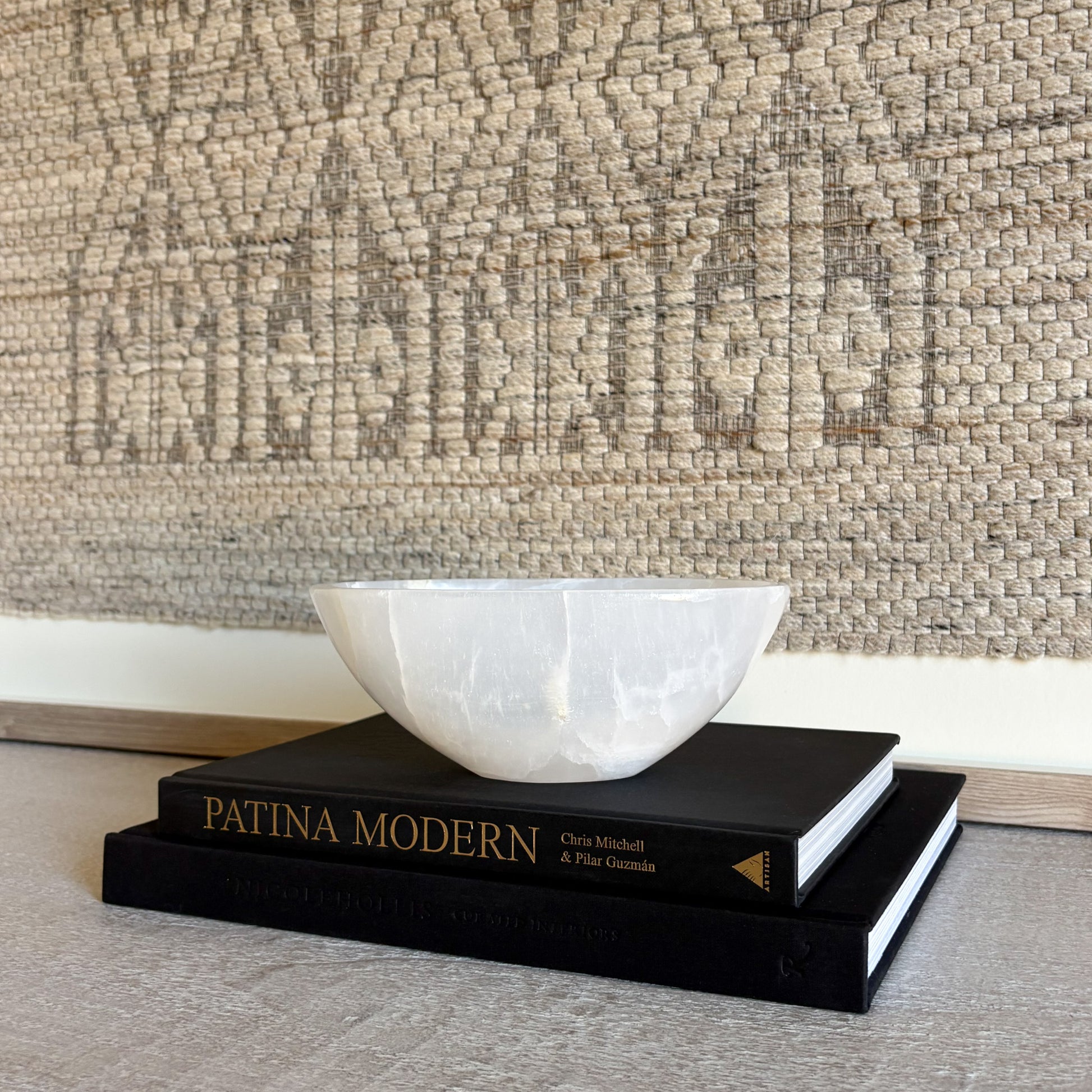 Small white onyx bowl shown in hand to highlight scale and handcrafted stone design