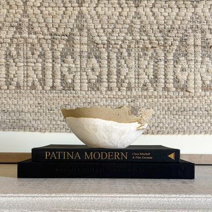 Hand-carved white onyx bowl showcasing natural veining and polished stone finish