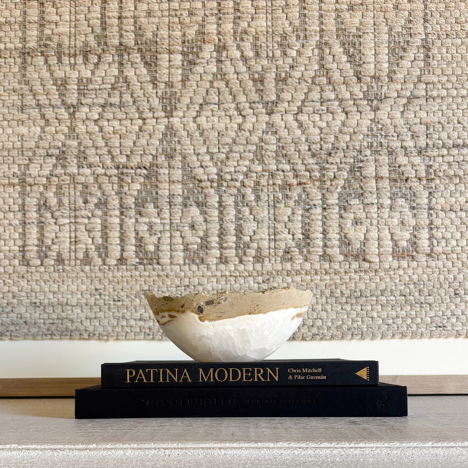 Small white onyx bowl shown in hand to highlight scale and handcrafted stone design