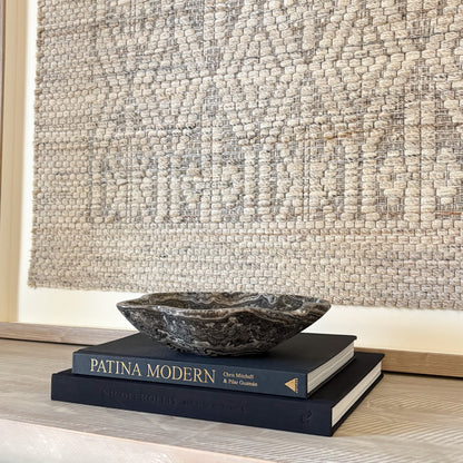 One-of-a-kind small hand-carved zebra onyx bowl used as a natural stone home décor accent