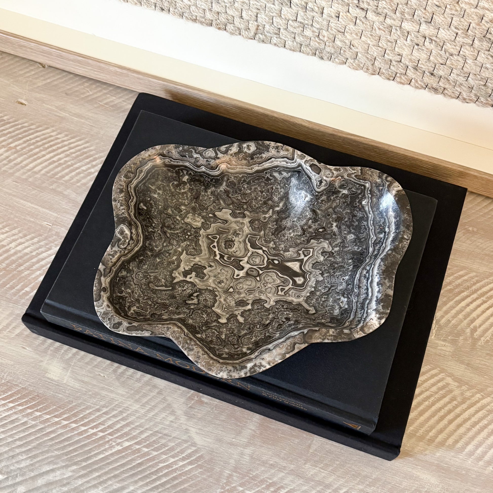 Small hand-carved zebra onyx bowl used as decorative stone accent