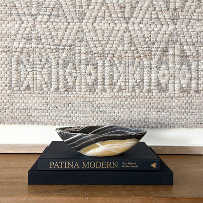 Contemporary home styling featuring hand carved zebra onyx stone bowl