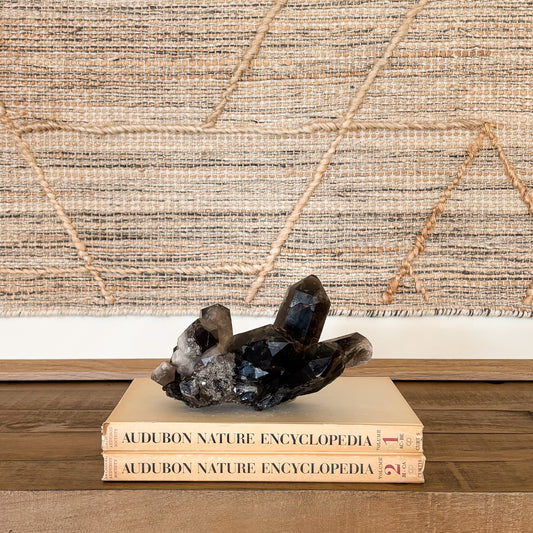 Smoky quartz crystal cluster used as natural home decor