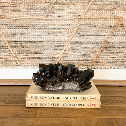 Raw smoky quartz crystal cluster with earthy brown crystals and natural formation