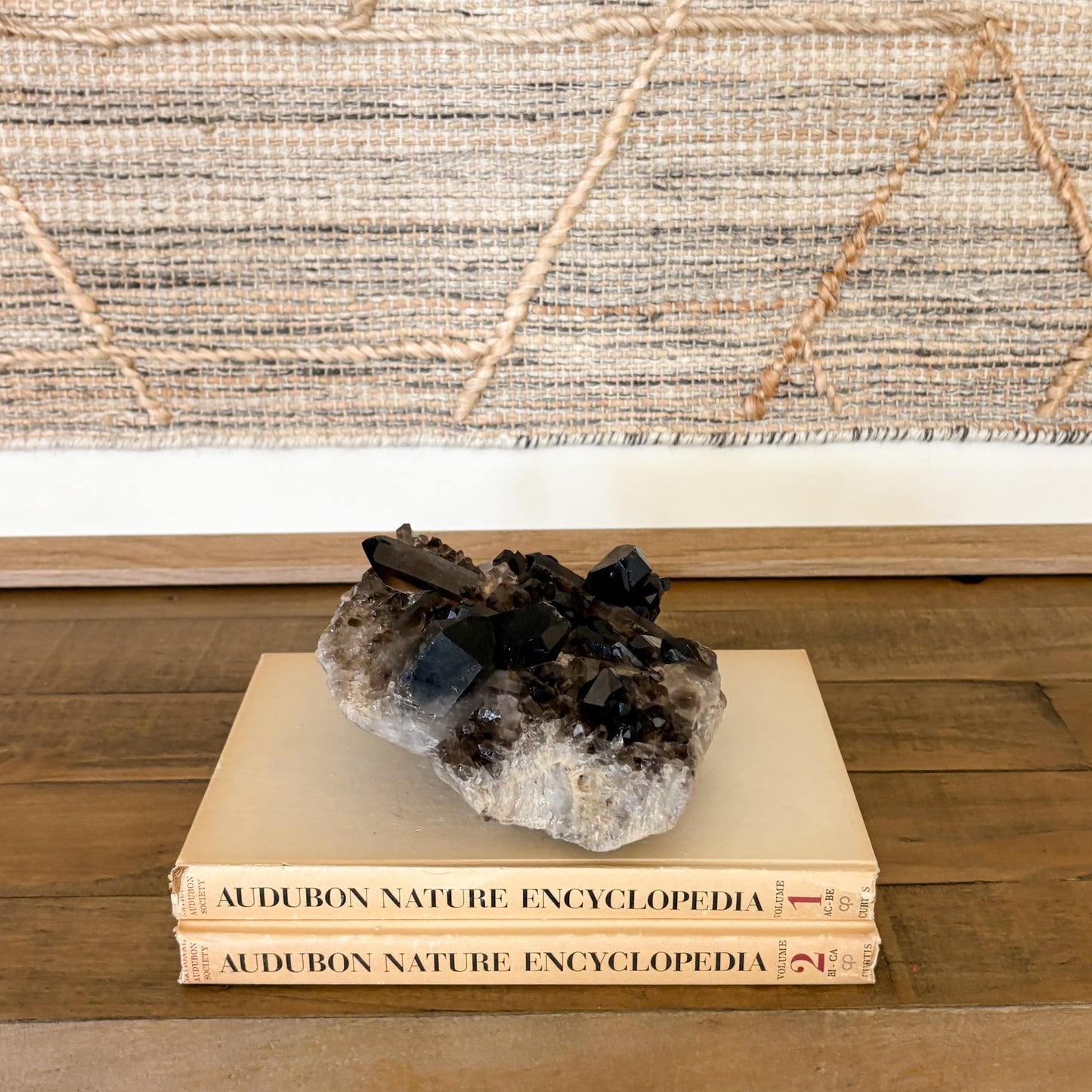 Natural smoky quartz crystal cluster grounding stone used as aesthetic home decor.