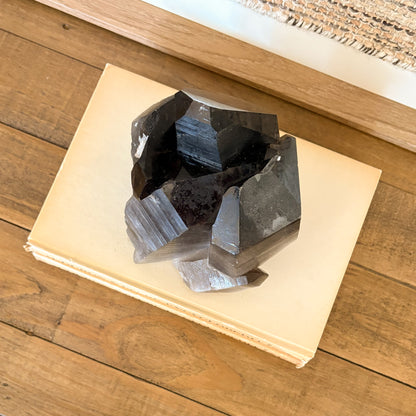 Smoky quartz crystal cluster displayed as modern boho home decor accent