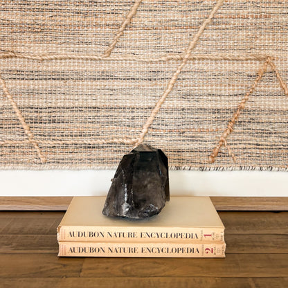 Natural smoky quartz crystal cluster used as elegant neutral home deco