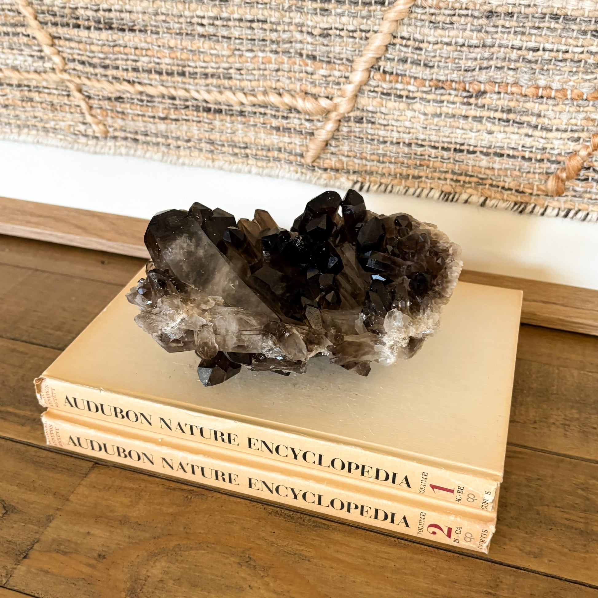 Luxury smoky quartz crystal cluster centerpiece with natural mineral formation and deep smoky brown quartz crystals.