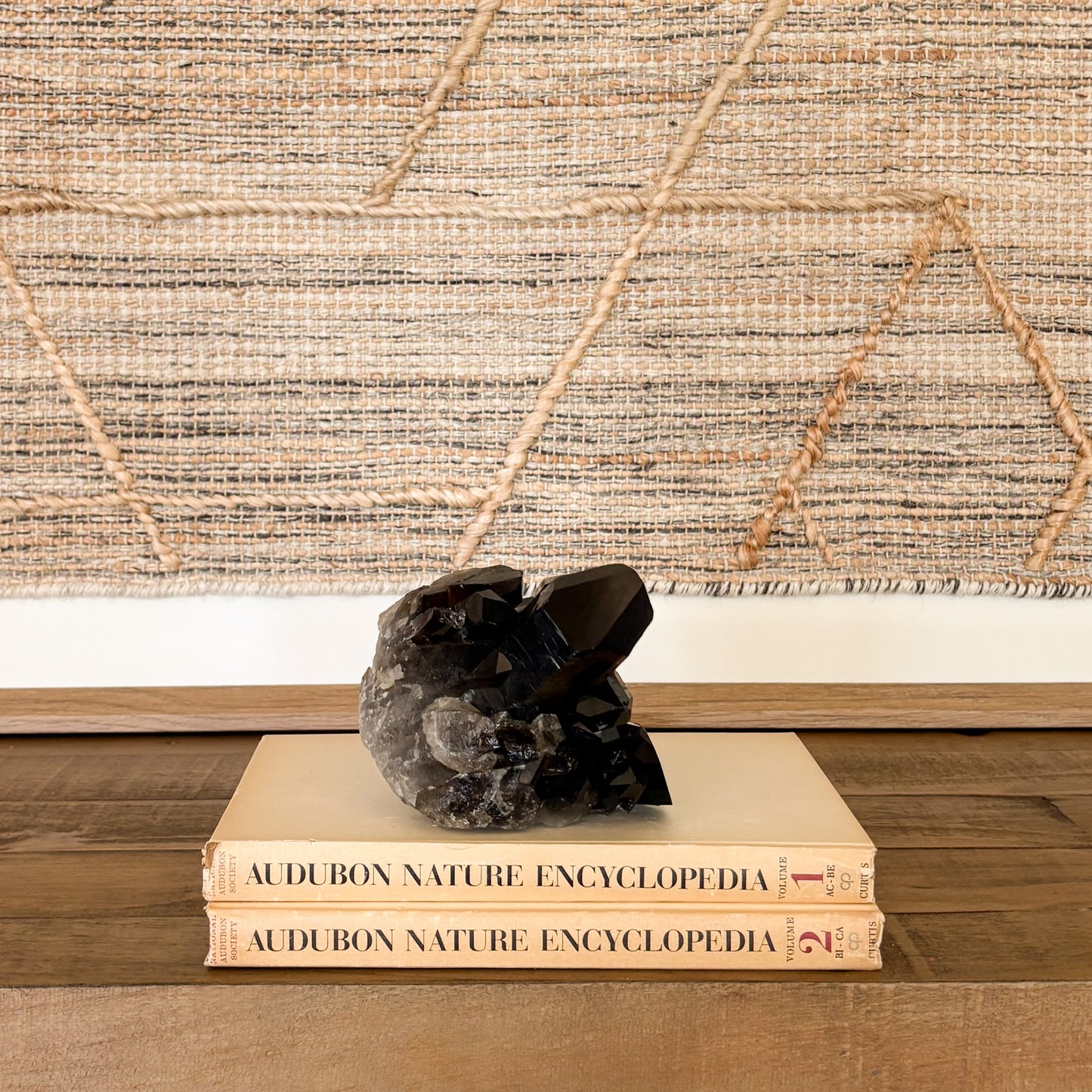 Large smoky quartz crystal cluster grounding stone used for meditation and home decor.