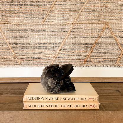 Large smoky quartz crystal cluster grounding stone used for meditation and home decor.