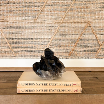 Smoky quartz crystal cluster decorative mineral specimen used as natural home decor.