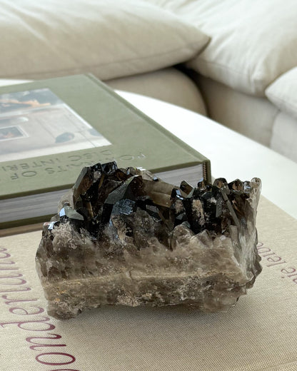 Raw smoky quartz crystal cluster with rich brown translucent crystal points
