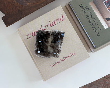 Unique smoky quartz crystal cluster with naturally formed crystal points and earthy tones