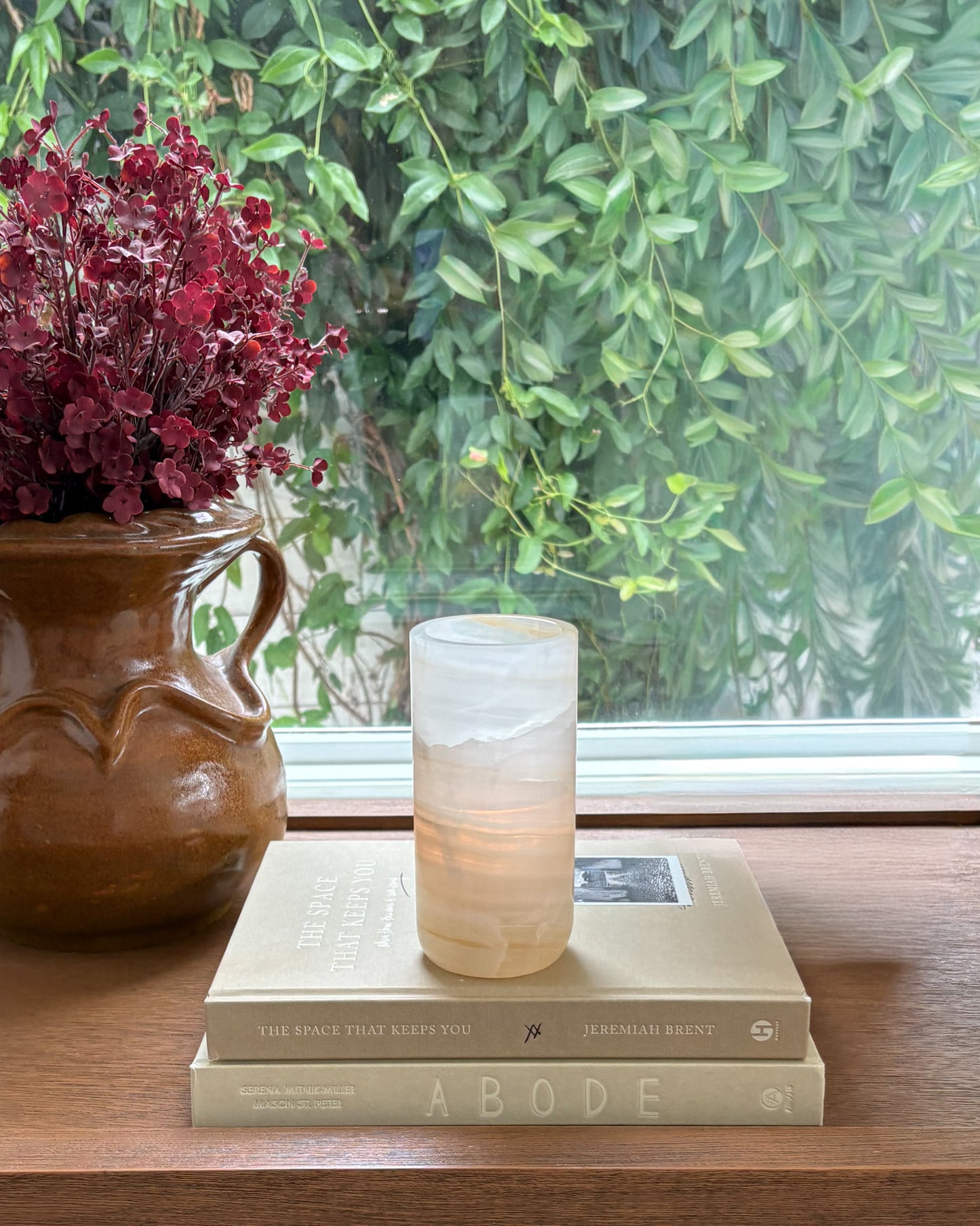 Hand-carved white onyx cylinder candle holder with polished finish