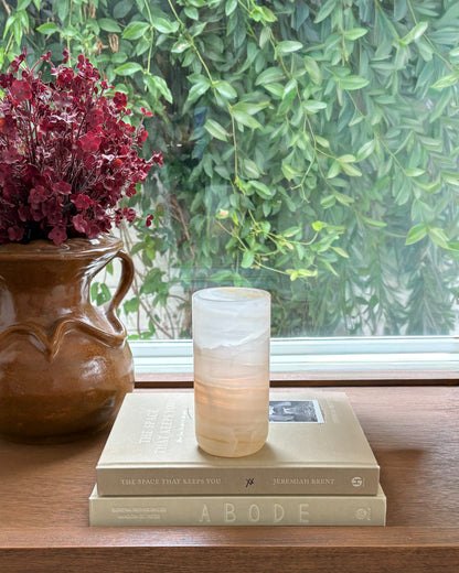Hand-carved white onyx cylinder candle holder with polished finish