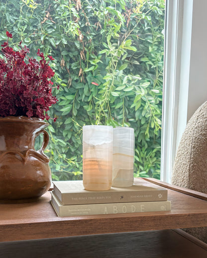 White onyx votive candle holder with organic stone texture and veining