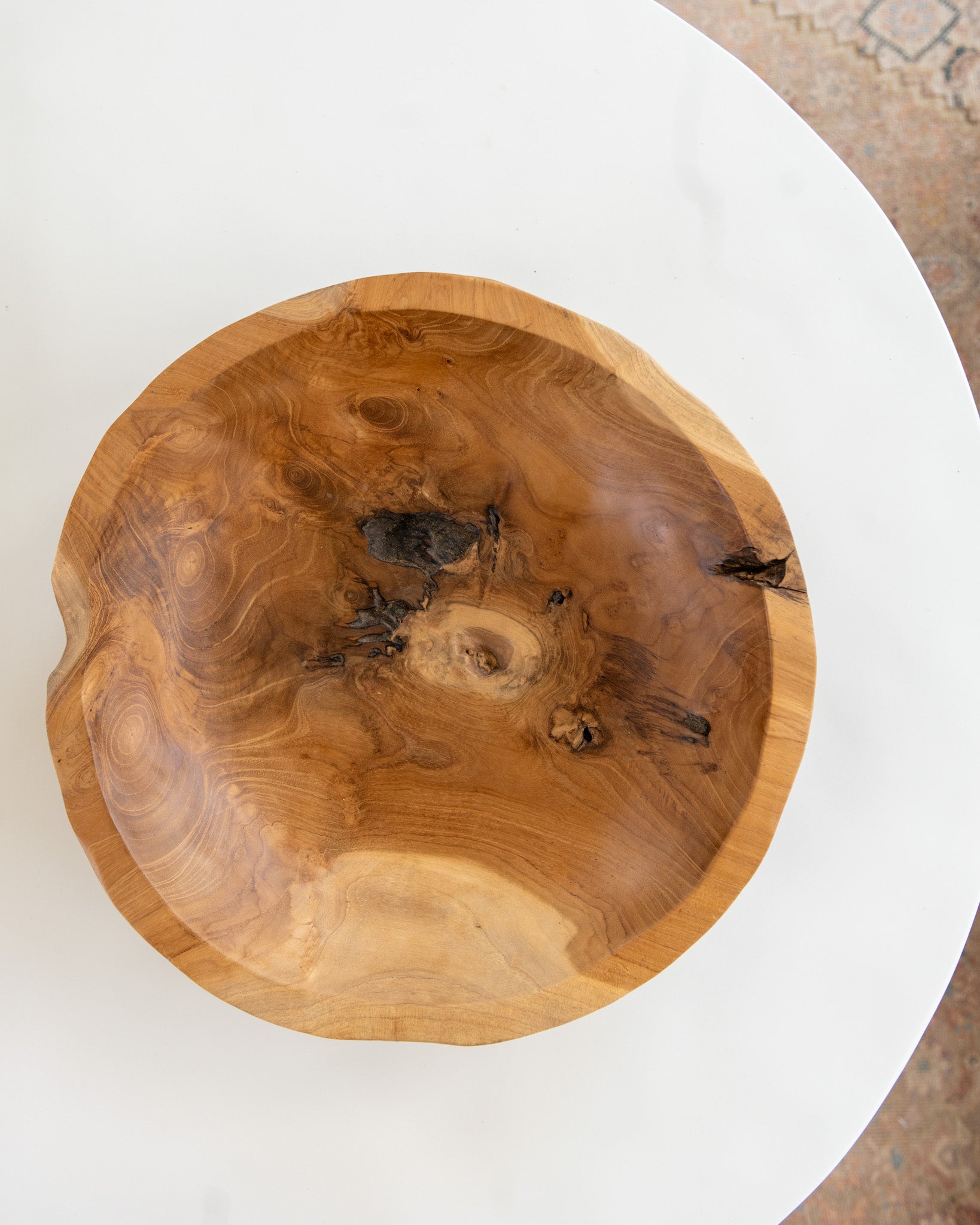 Natural teak wood bowl showcasing warm tones and organic wood grain