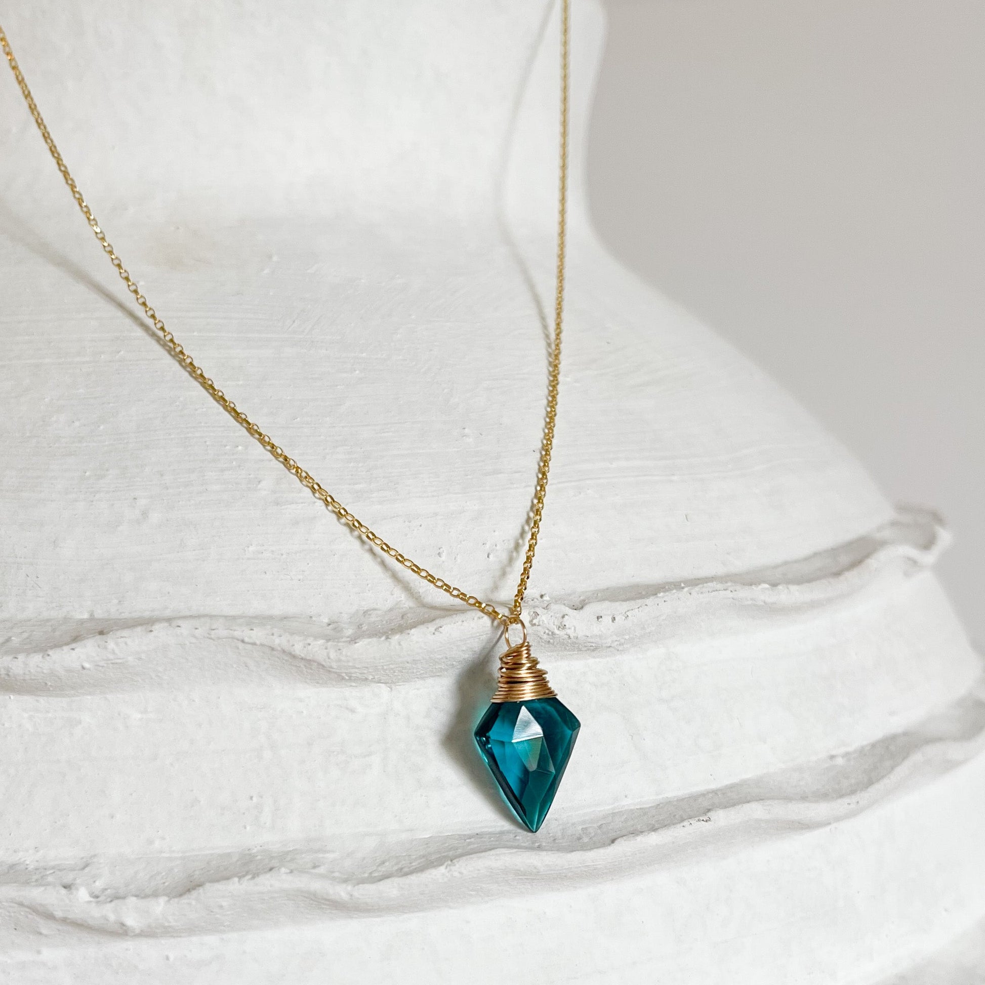 teal-blue faceted crystal necklace