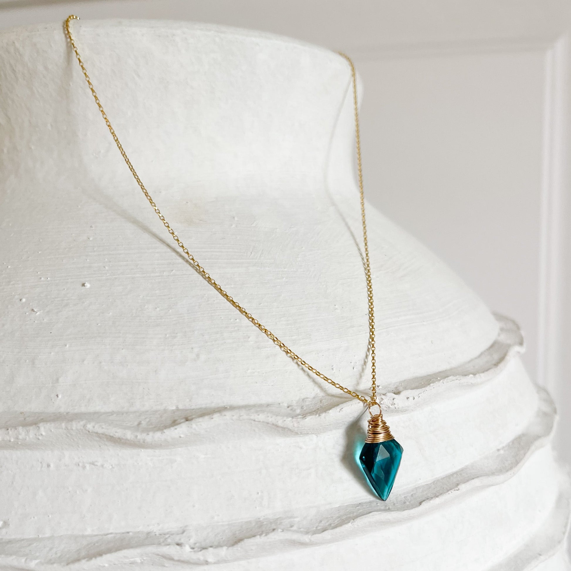 teal-blue crystal pendant necklace