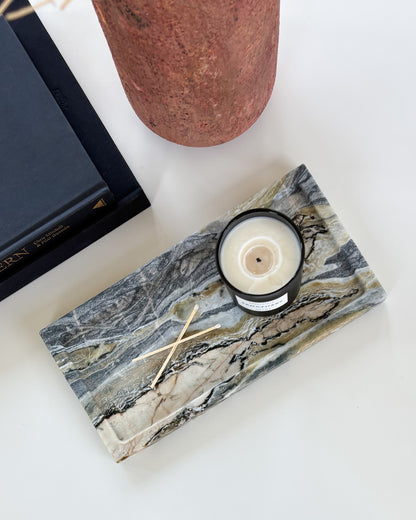 Decorative marble tray styled with a candle and wooden matches