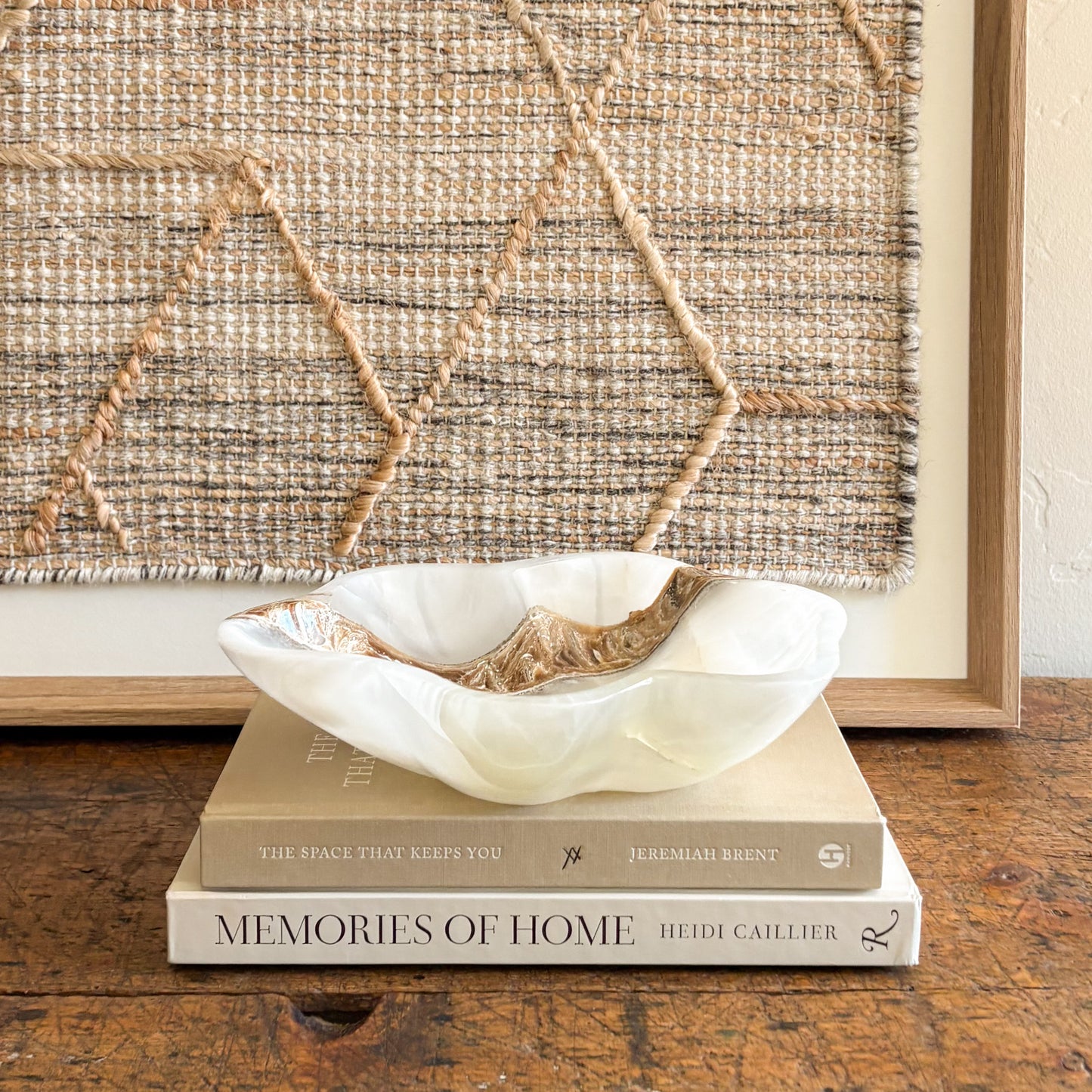 Luxury white onyx bowl used as a decorative accent in modern neutral interior