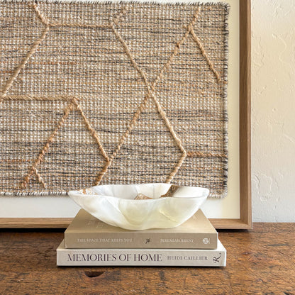 White onyx stone bowl with organic shape and smooth polished edge