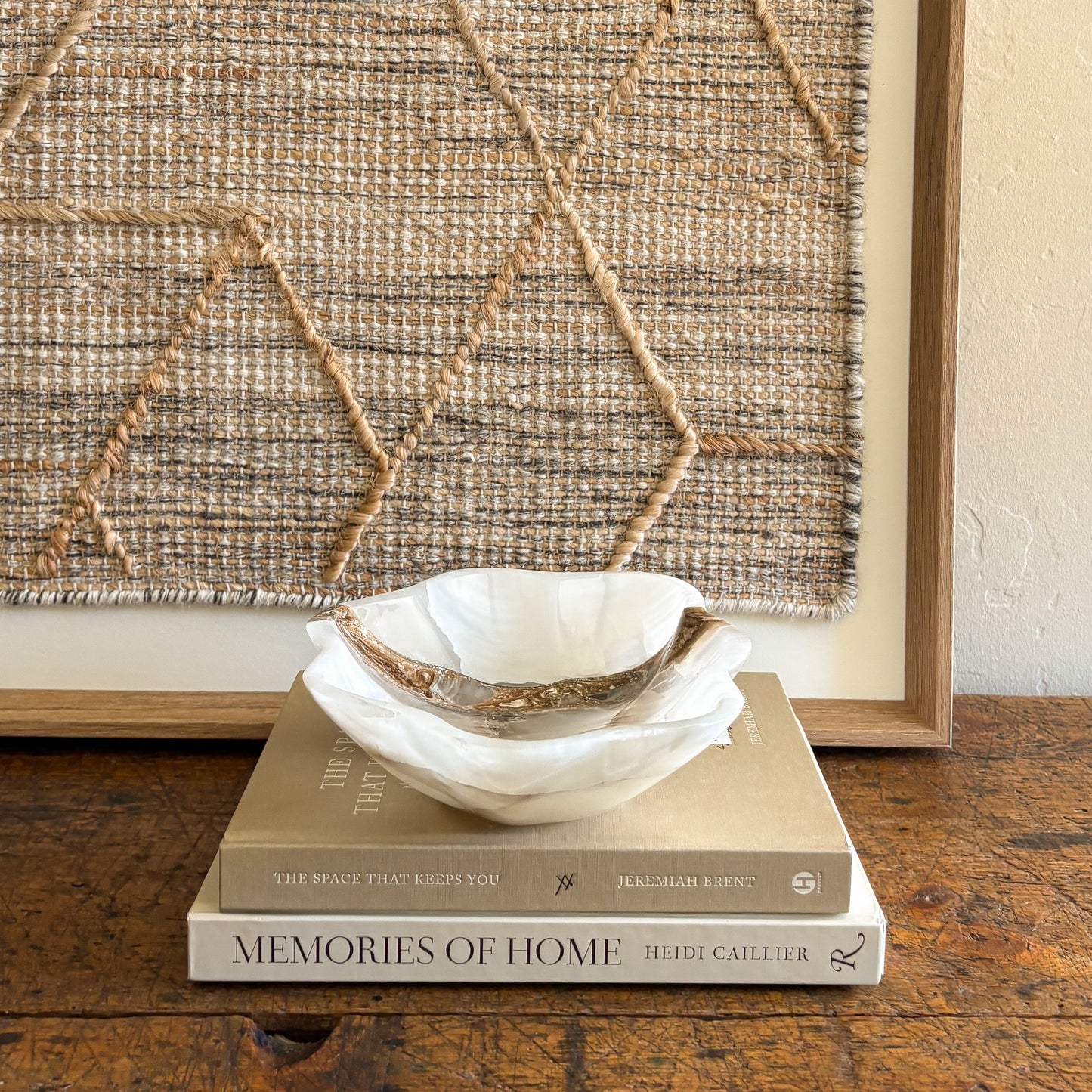 Natural white onyx decorative bowl styled as elevated home accent
