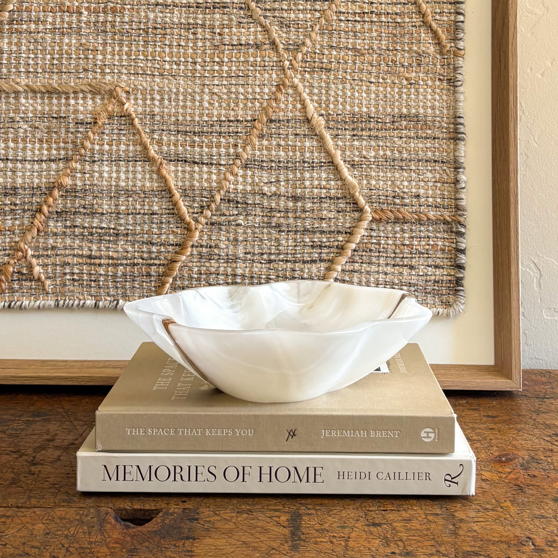 Natural white onyx decorative bowl styled as elevated home accent