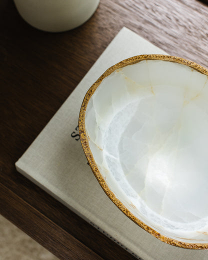 Artisan hand carved white onyx bowl featuring unique natural stone patterns