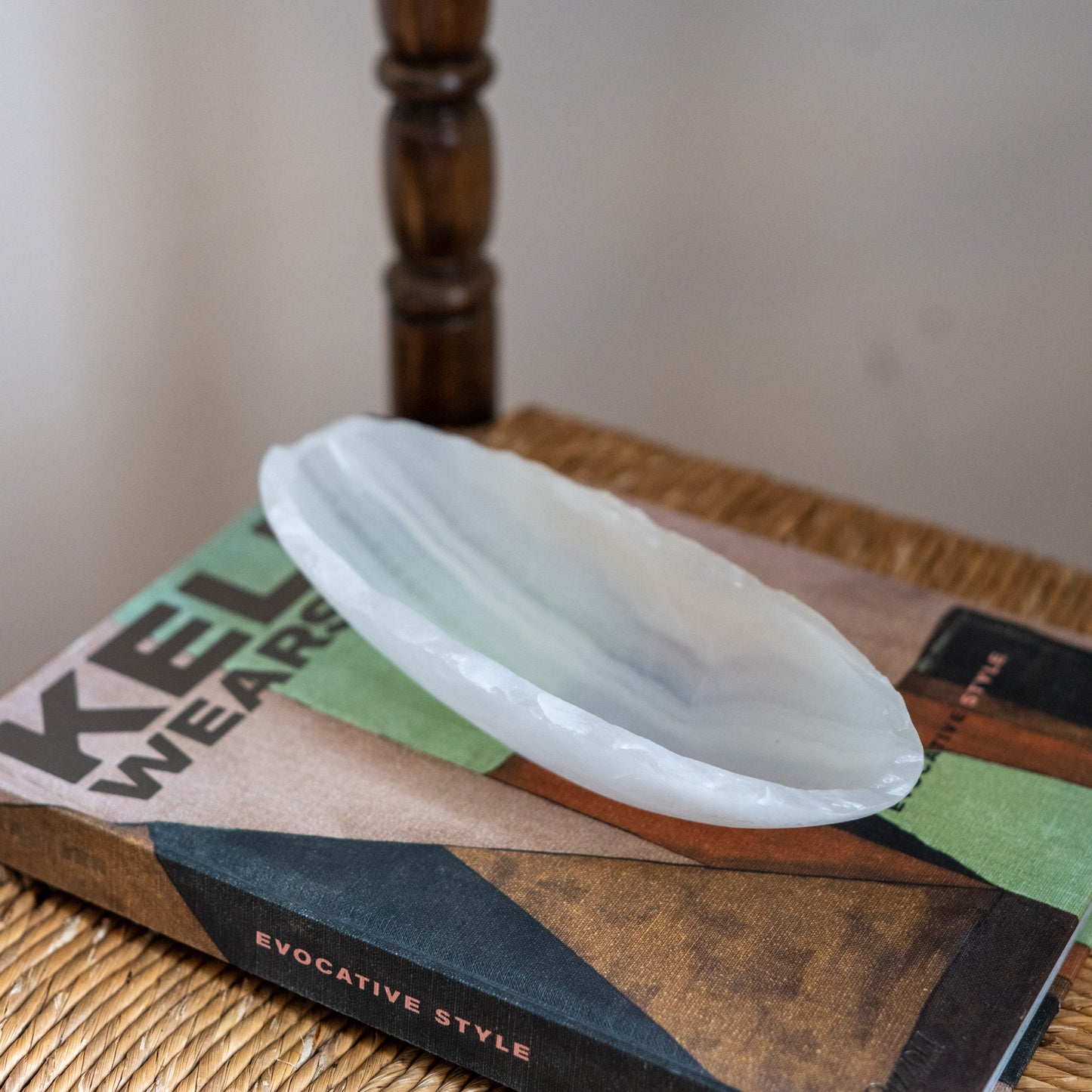 Minimalist white onyx canoe tray styled on designer interior décor book