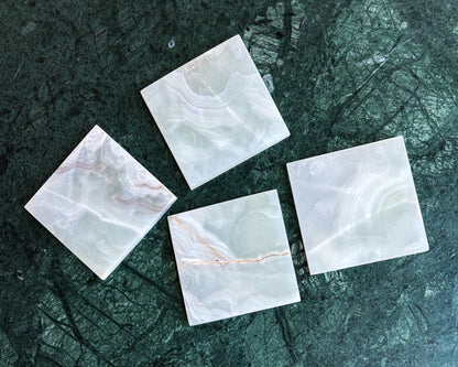 Genuine white onyx drink coasters with unique natural patterns and smooth polished surface