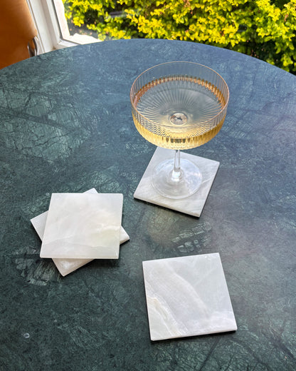 White onyx coasters handcrafted from solid natural stone for modern organic interiors