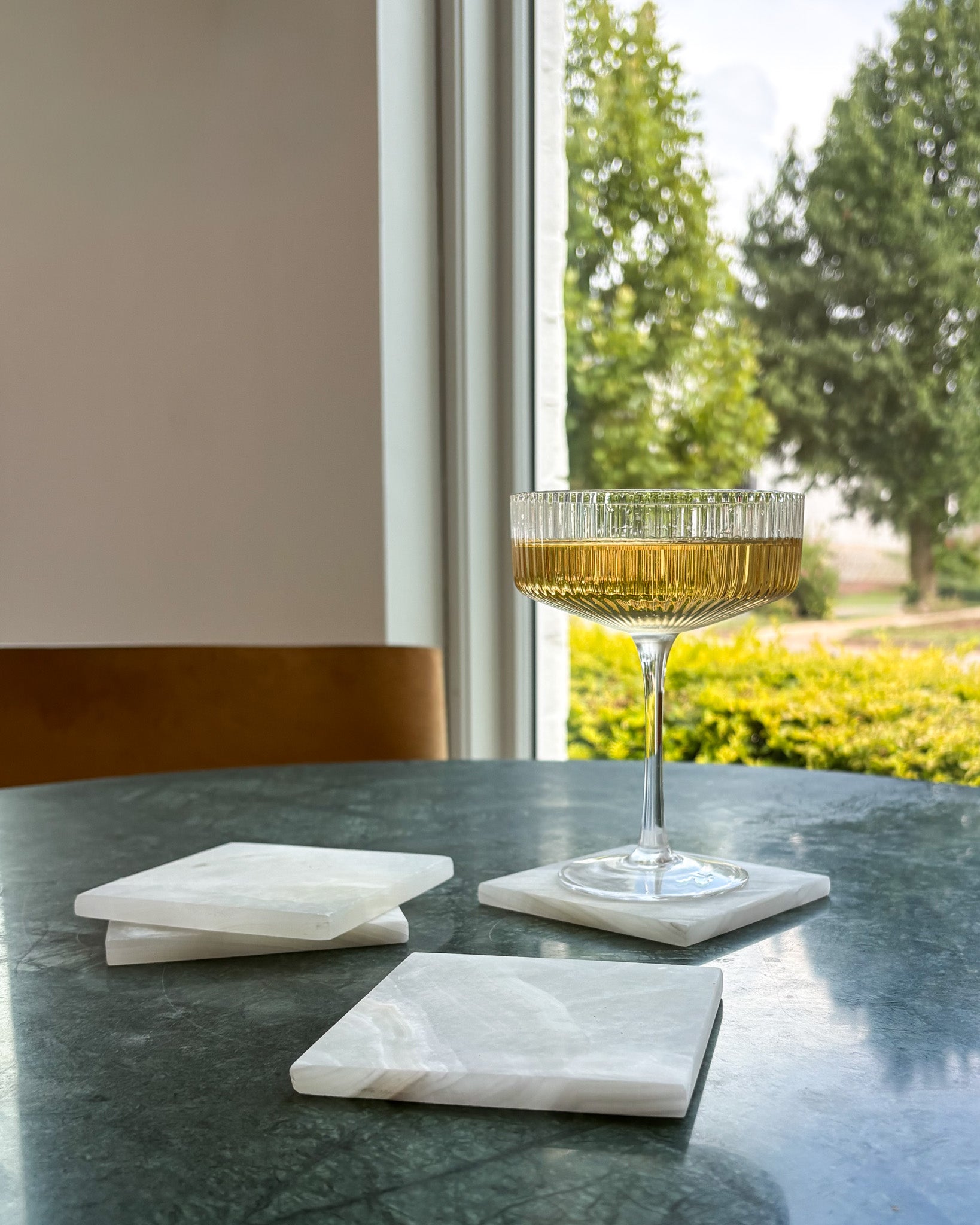One-of-a-kind white onyx coaster set showcasing beautiful natural veining and organic patterns
