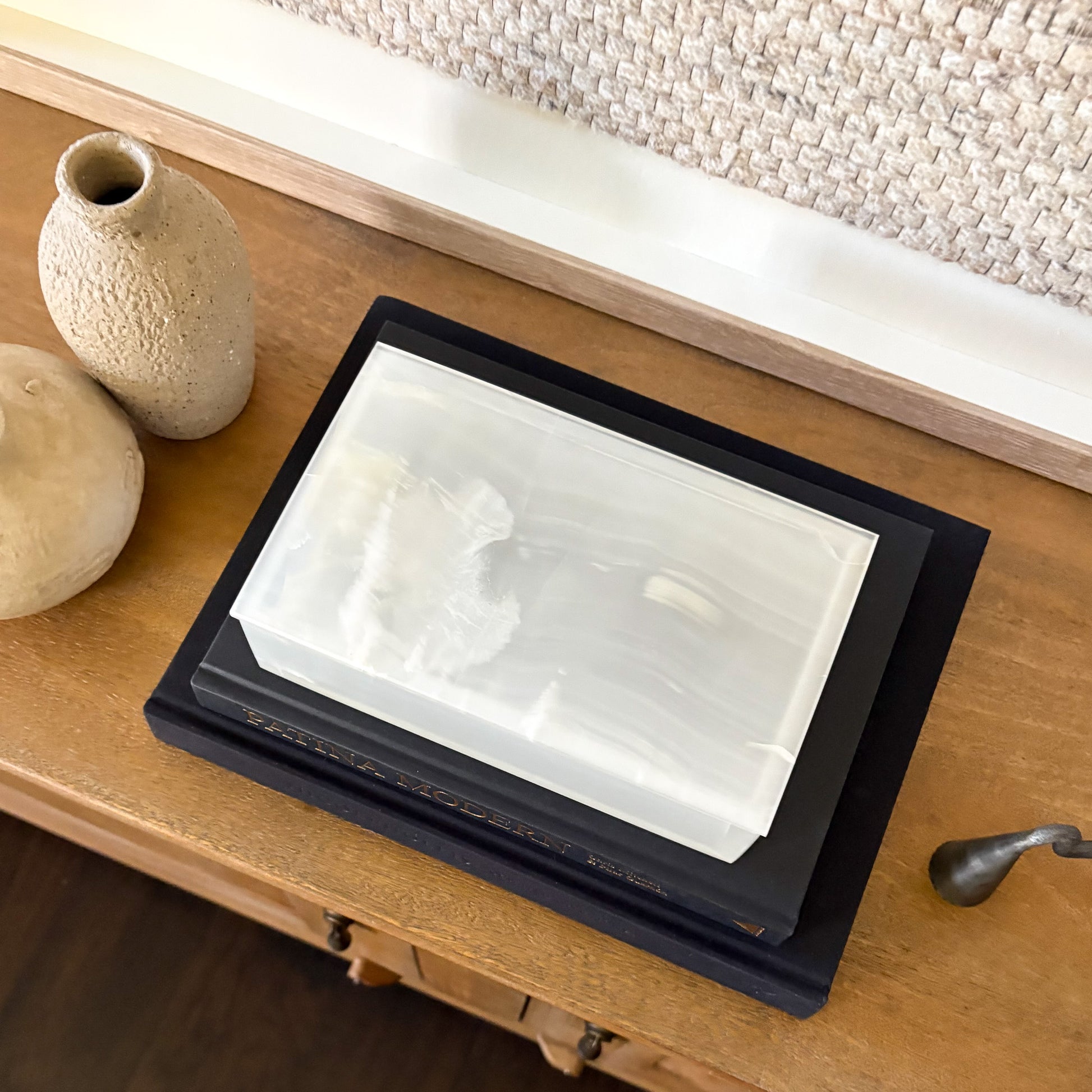 Luxury rectangular white onyx jewelry box displayed on modern console table with neutral home decor