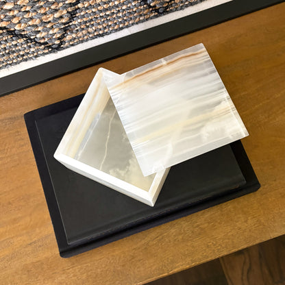 White onyx square box with lid removed showing polished interior