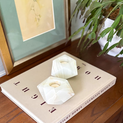 Contemporary white onyx candle holders creating a cozy home ambiance