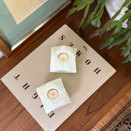 Decorative white onyx tealight holders styled in a modern interior