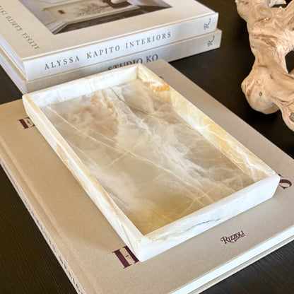 white stone tray with natural veining styled in minimalist living room setting