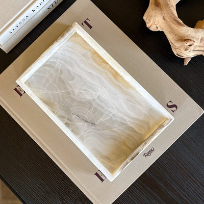 luxury white onyx tray on coffee table with neutral home decor styling