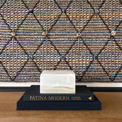White onyx square lidded box styled on black coffee table books