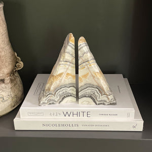 white, yellow, and black onyx bookend pair