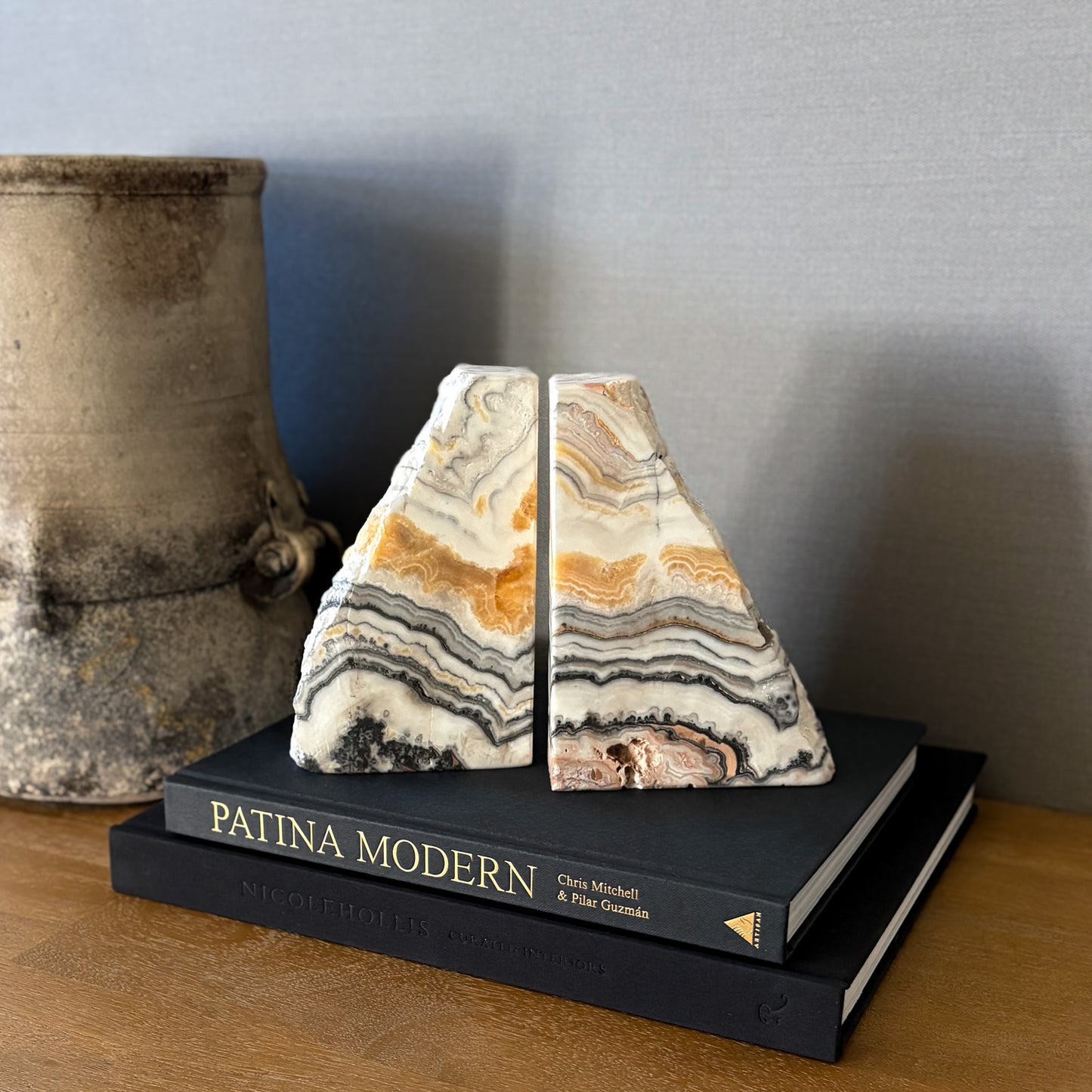 Polished zebra calcite bookends with layered black and beige veining